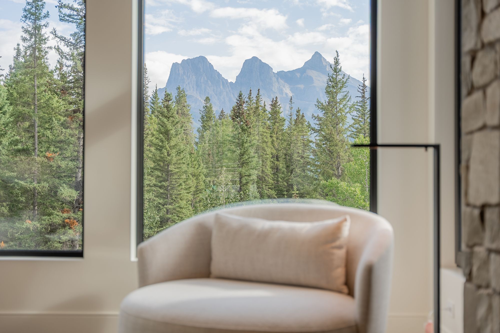 A chair at the window, the Three Sisters beyond