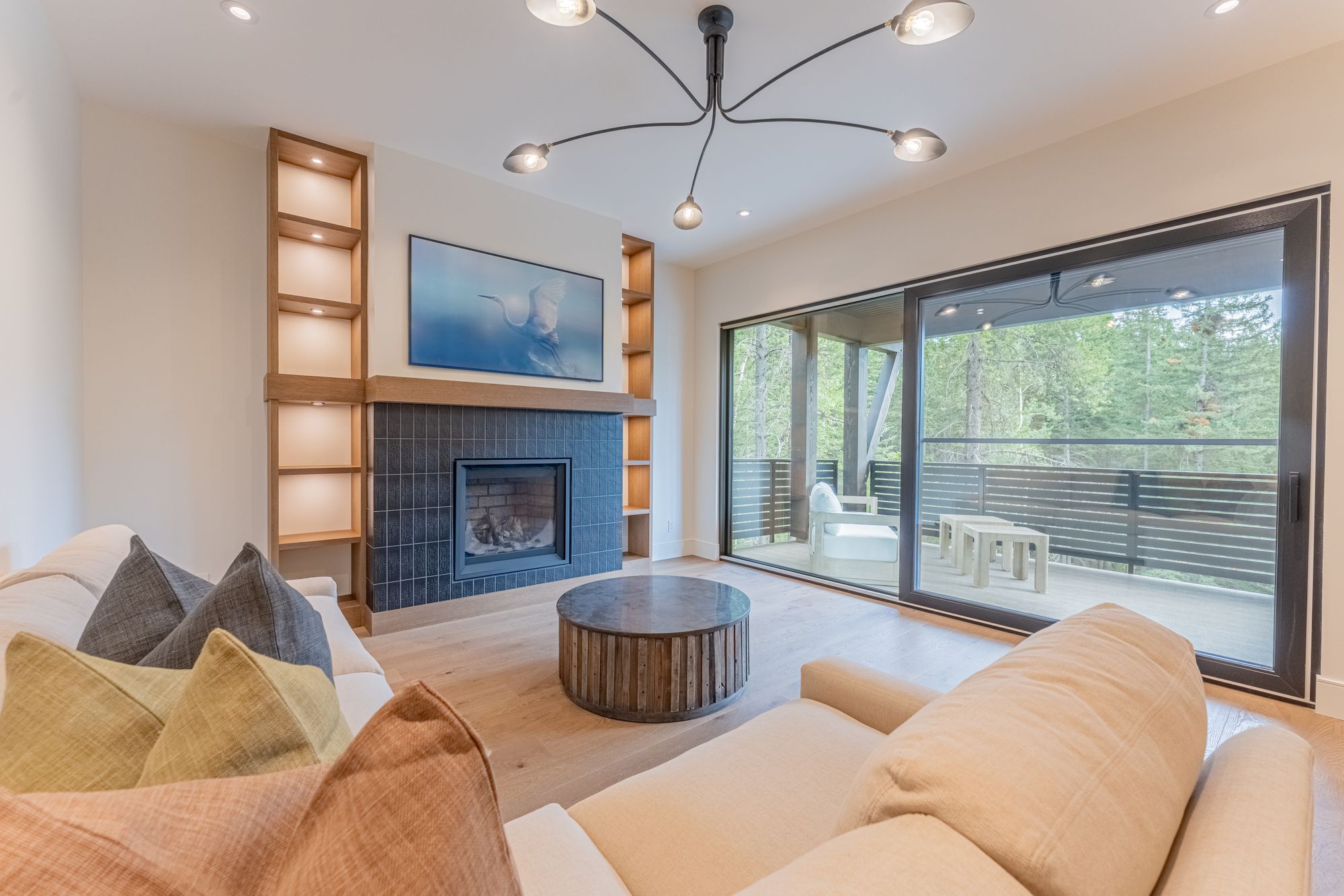 The mid-level living room, the fireplace and the doors to the deck
