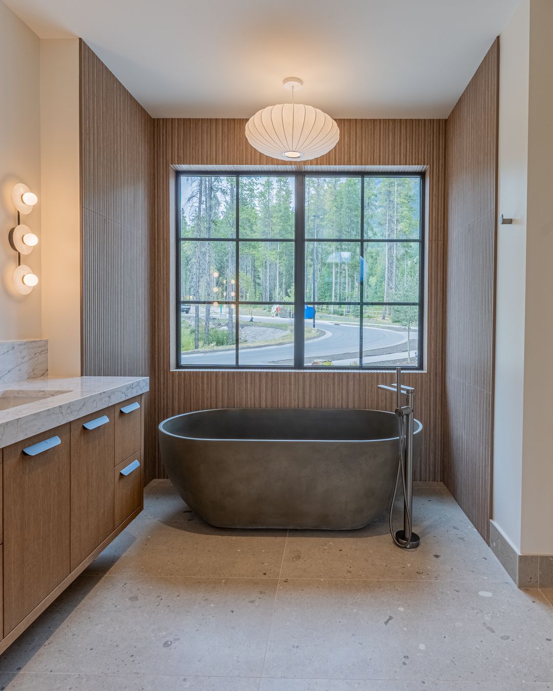 The primary bath, the stone tub under the window