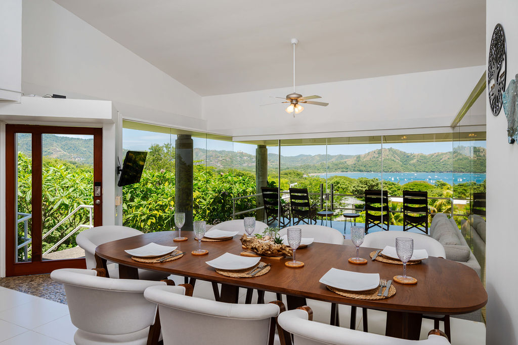 Dining room with bay view through the glass wall