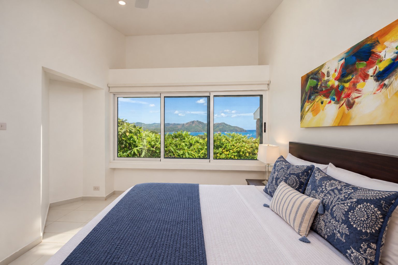 The second bedroom, king bed and the bay through the window