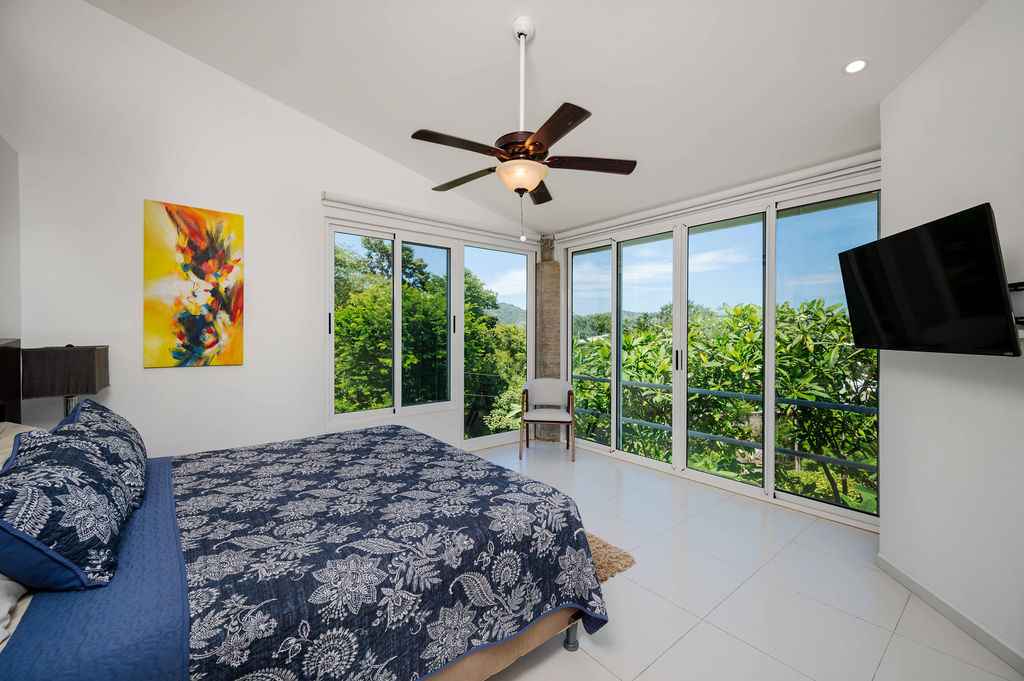 Master bedroom with king bed and direct outdoor access