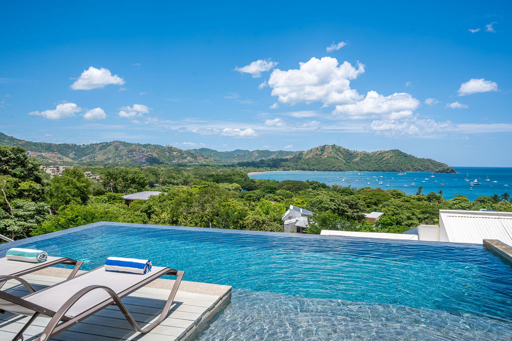 Infinity pool from water level, bay beyond