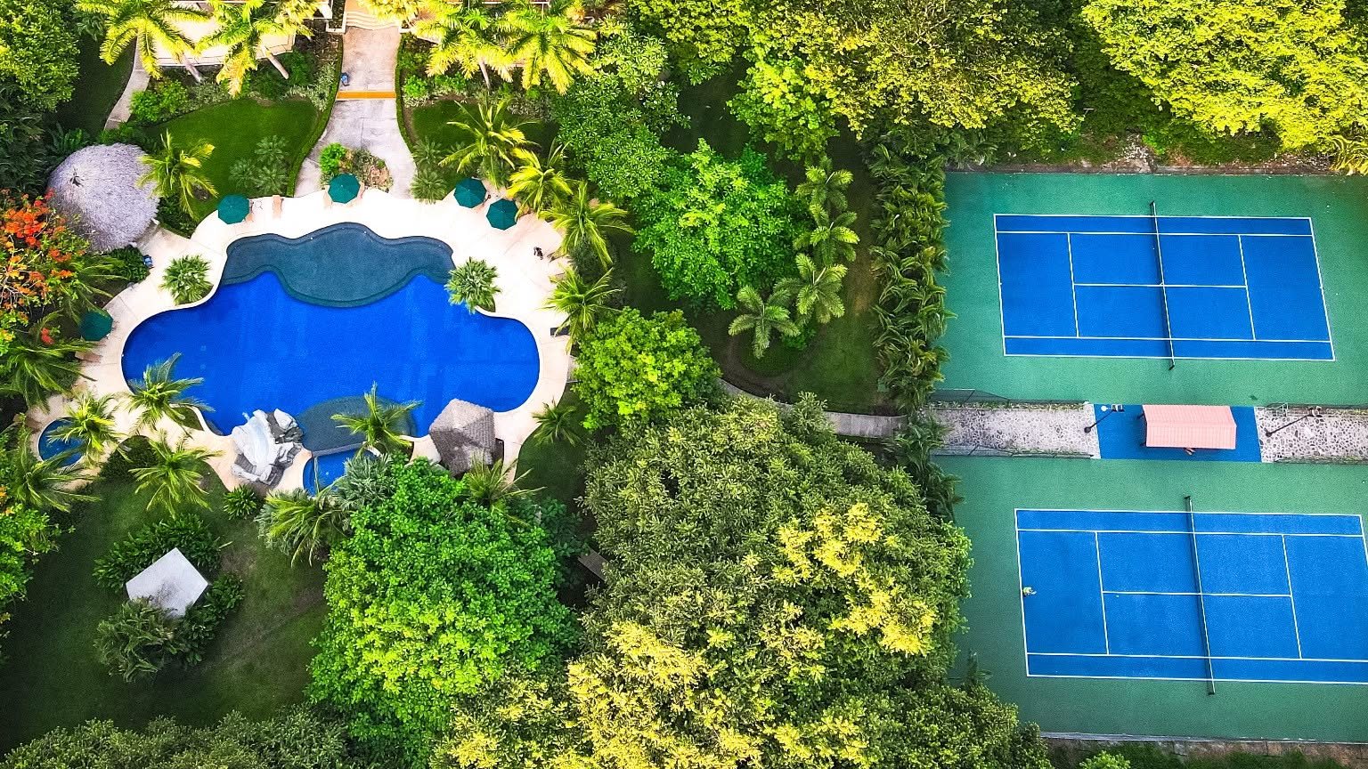 The Club at Coco Bay from the air: the pool, the courts and the clubhouse